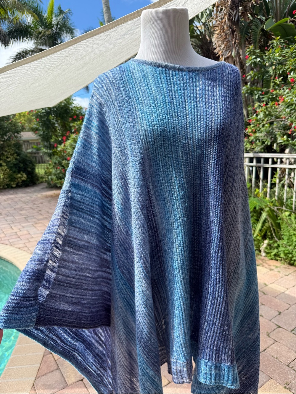 Beautiful blue poncho style sweater Chico’s in size small medium.